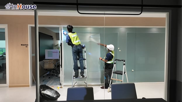Installing film on the large glass wall smart film The crew finishes the whole glass wall seamlessly — Copeland Thailand — Smart Film Meeting-Room Partition, Rayong Factory