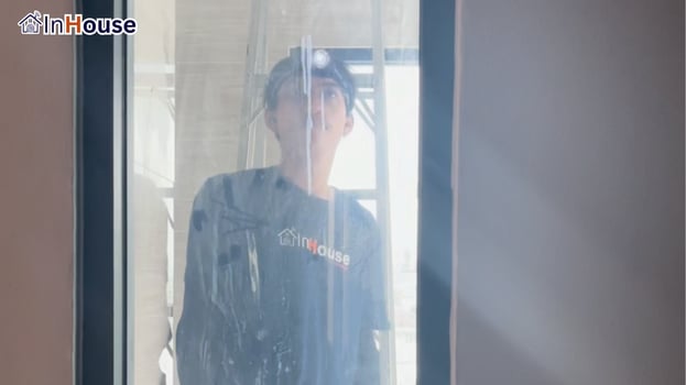 The InHouse crew installing from outside smart film Working in fine detail at every angle — Khun Jomjaem — Luxury condo bathroom, privacy at the press of one remote