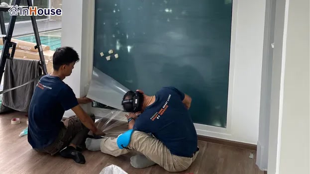 Starting the smart film install · smart film · a modern, private workout room — Khun Rachanon Private Home Gym & Poolside Smart Glass